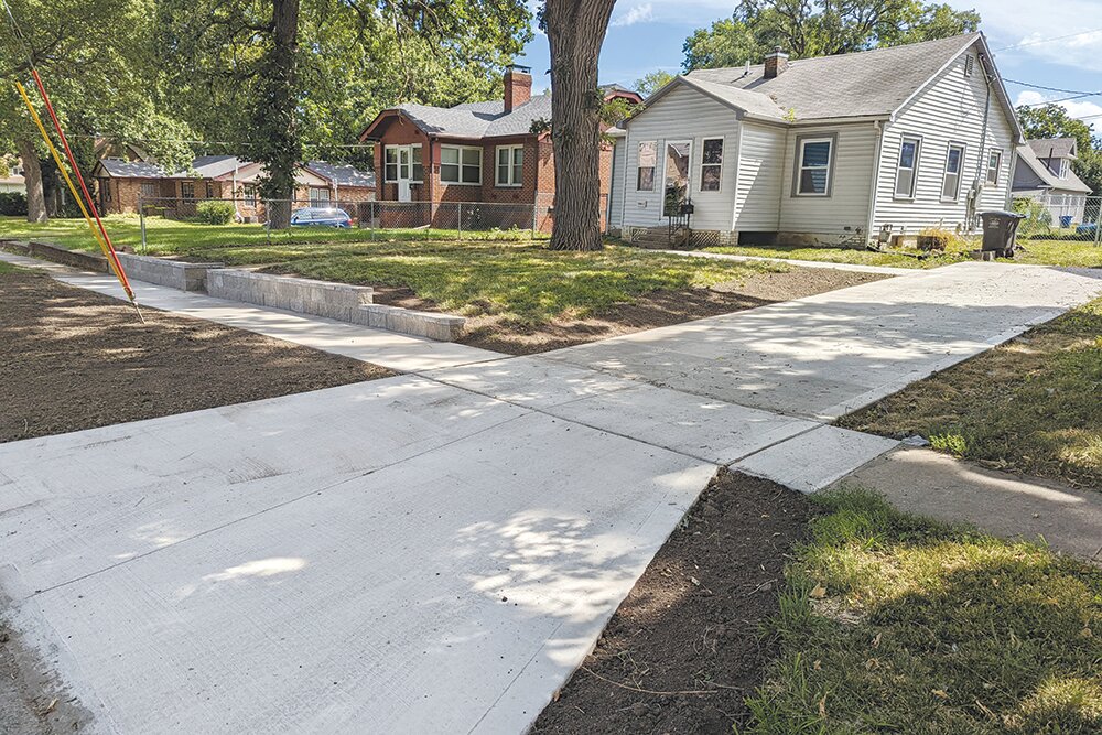An after photo shows driveway repairs reimbursed in part by Invest DSM, Des Moines, Iowa's neighborhood block grant program. This program was the inspiration for Restore SGF.